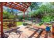 This backyard features a wooden deck with a hammock and wooded perimeter at 1166 Montford Dr, Charlotte, NC 28209