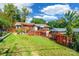 This spacious backyard features a deck, a wooden fence, and mature trees at 1166 Montford Dr, Charlotte, NC 28209