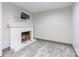 Cozy fireplace in finished basement with tile flooring and a clean, white mantle at 1166 Montford Dr, Charlotte, NC 28209