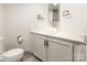 This bathroom features a modern vanity with a round sink, and a toilet at 1166 Montford Dr, Charlotte, NC 28209