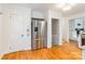 Modern eat-in kitchen featuring stainless steel appliances, white cabinets, and hardwood floors for seamless elegance at 1166 Montford Dr, Charlotte, NC 28209