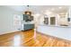 A modern kitchen area with sleek cabinets, stainless steel appliances, and hardwood floors at 1166 Montford Dr, Charlotte, NC 28209