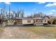 House exterior showcasing a covered porch and well-maintained lawn at 119 Loray Ln, Statesville, NC 28625