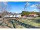 View of the back of the house, showing a large yard and storage shed at 119 Loray Ln, Statesville, NC 28625