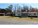 Single-story home with covered porch and landscaped yard at 119 Loray Ln, Statesville, NC 28625