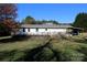 Single-story home with covered porch and detached shed at 119 Loray Ln, Statesville, NC 28625