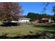 Single-story home with covered porch and detached shed at 119 Loray Ln, Statesville, NC 28625