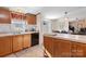 Eat-in kitchen with island, wood cabinets, and black appliances at 119 Loray Ln, Statesville, NC 28625