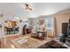 Cozy living room featuring a wood stove, comfortable seating, and hardwood floors at 119 Loray Ln, Statesville, NC 28625