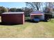 Metal shed and carport provide ample storage space at 119 Loray Ln, Statesville, NC 28625