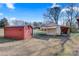 Metal shed and carport provide ample storage space at 119 Loray Ln, Statesville, NC 28625