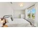 Bedroom with metal bed frame and large window at 1547 Rye Rd, Mount Holly, NC 28120