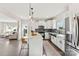 Modern kitchen with white cabinets, marble island, and stainless steel appliances at 1547 Rye Rd, Mount Holly, NC 28120