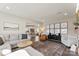 Open living room with a view into the kitchen and ample natural light at 1547 Rye Rd, Mount Holly, NC 28120