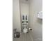 Full bathroom with toilet, storage cabinet, and tile flooring at 17420 Midnight Express Way, Cornelius, NC 28031