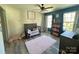 Charming bedroom with crib, plush rug, and built-in shelving at 17420 Midnight Express Way, Cornelius, NC 28031