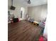 Bright playroom with hardwood floors and built-in shelving at 17420 Midnight Express Way, Cornelius, NC 28031