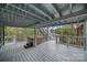 This spacious back deck features a hot tub, covered area, and staircase access to the backyard at 26034 Misty Way Dr, Fort Mill, SC 29708