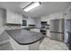 Bright kitchen with white cabinets, stainless steel appliances and a tiled backsplash at 26034 Misty Way Dr, Fort Mill, SC 29708