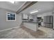 Modern kitchen featuring white cabinets, stainless steel appliances, and dark countertops at 26034 Misty Way Dr, Fort Mill, SC 29708