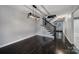 Inviting living room with staircase boasts hardwood floors and modern lighting, creating a warm and stylish ambiance at 26034 Misty Way Dr, Fort Mill, SC 29708