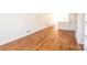 Long bedroom with built in shelving and hardwood floors at 815 6Th Sw Ave, Hickory, NC 28602