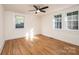 Well-lit bedroom with hardwood floors and two windows at 815 6Th Sw Ave, Hickory, NC 28602