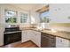 Updated kitchen with stainless steel appliances and white cabinets at 815 6Th Sw Ave, Hickory, NC 28602