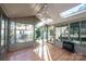 Sunroom with wood floors, skylights, and a fireplace at 815 6Th Sw Ave, Hickory, NC 28602