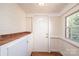 Sunroom with wood floors, tiled counter, and exterior access at 815 6Th Sw Ave, Hickory, NC 28602