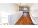 Bright upper hallway with built-in shelving and hardwood floors at 815 6Th Sw Ave, Hickory, NC 28602