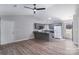 Kitchen with grey cabinetry, eat-in peninsula, stainless appliances, and luxury vinyl flooring at 1969 Beth Haven Church Rd, Denver, NC 28037