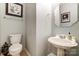 Small powder room with pedestal sink and toilet at 7484 Brentfield Ln, Stanley, NC 28164