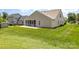 Spacious backyard featuring a screened-in porch, green lawn, and neighboring houses at 135 Anastasia Ln, Lincolnton, NC 28092
