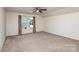 Bright bedroom with neutral carpet, large window with curtains, and abundant natural light at 135 Anastasia Ln, Lincolnton, NC 28092