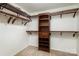 Walk-in closet features custom shelving and clothing rods for efficient storage and organization at 135 Anastasia Ln, Lincolnton, NC 28092