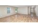 Spacious room with new flooring, natural lighting, and a view of the entrance at 135 Anastasia Ln, Lincolnton, NC 28092