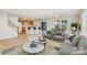 Inviting living area with a modern kitchen, open floor plan, hardwood floors, and lots of natural light at 135 Anastasia Ln, Lincolnton, NC 28092