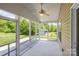 Enclosed screened porch with a ceiling fan provides a relaxing outdoor living space at 135 Anastasia Ln, Lincolnton, NC 28092