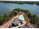 Breathtaking aerial view of a lakefront home with a pristine pool and lush landscaping at 4374 Morning Mist Dr # 25, Sherrills Ford, NC 28673