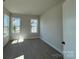 Sunlit bedroom with large windows, hardwood floors, and neutral paint at 4374 Morning Mist Dr # 25, Sherrills Ford, NC 28673