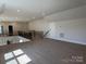 View of the spacious bonus room with an overlooking view of downstairs and a white door at 4374 Morning Mist Dr # 25, Sherrills Ford, NC 28673