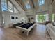 Large game room with a pool table, bar seating, and plenty of natural light from the expansive windows overlooking the lake at 4374 Morning Mist Dr # 25, Sherrills Ford, NC 28673