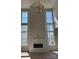 Bright living room features a modern fireplace, large windows and an elegant chandelier at 4374 Morning Mist Dr # 25, Sherrills Ford, NC 28673