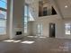 Bright living room featuring fireplace, big windows, hardwood floors and lots of sunlight at 4374 Morning Mist Dr # 25, Sherrills Ford, NC 28673