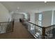 Lofted living room showcasing stylish staircase and modern railings at 4374 Morning Mist Dr # 25, Sherrills Ford, NC 28673