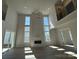A contemporary living room featuring a fireplace, big windows and hardwood flooring at 4374 Morning Mist Dr # 25, Sherrills Ford, NC 28673