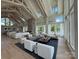 Spacious living room boasts a stone fireplace, high ceilings with wood beams, and lots of natural light from large windows at 4374 Morning Mist Dr # 25, Sherrills Ford, NC 28673