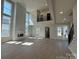 Spacious living room with large windows, fireplace, hardwood floors, and lots of natural light at 4374 Morning Mist Dr # 25, Sherrills Ford, NC 28673