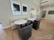 Cozy seating area with a built-in bench, marble tables, and stylish chairs, perfect for casual conversations or meetings at 4374 Morning Mist Dr # 25, Sherrills Ford, NC 28673